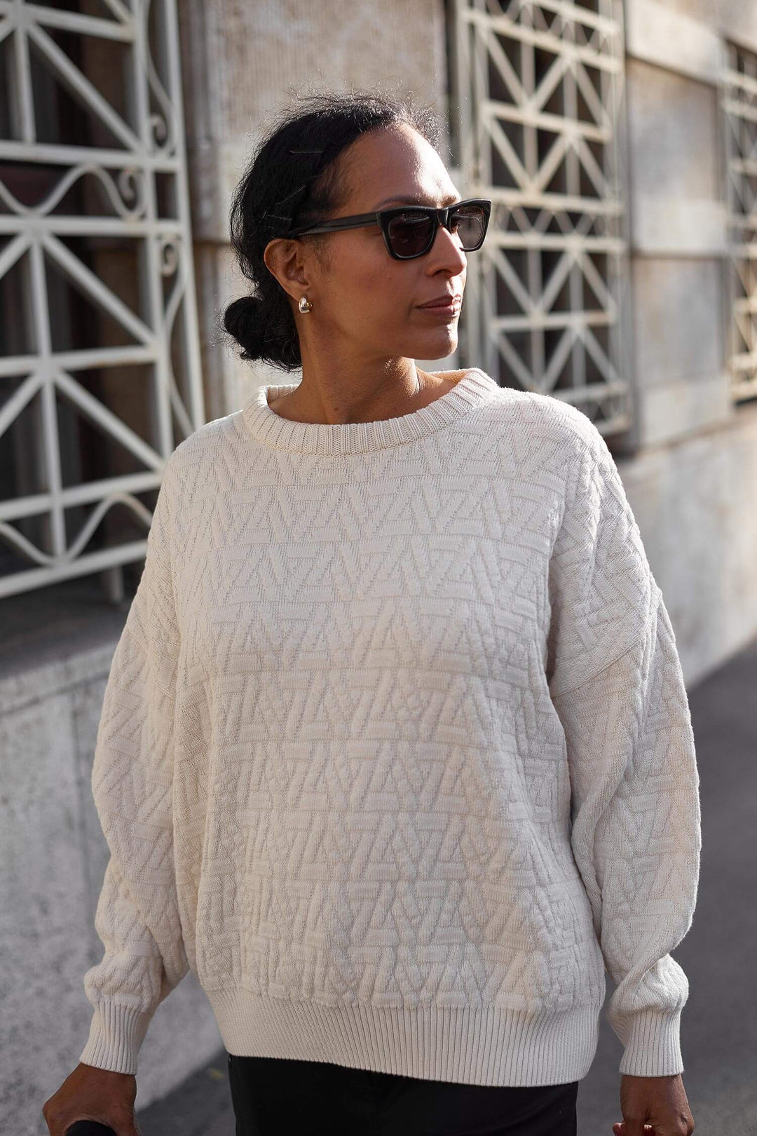 Popular chunky oversized knitted triangle pullover made from organic cotton